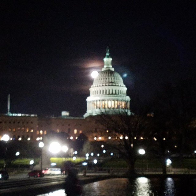 U.S. Capitol Building with full moon