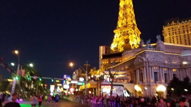 There's the Paris, with the mini Eiffel Tower all lit up. You can see how thick the crowd was here, and this was still early in the race. Las Vegas Rock 'n' Roll Marathon 14