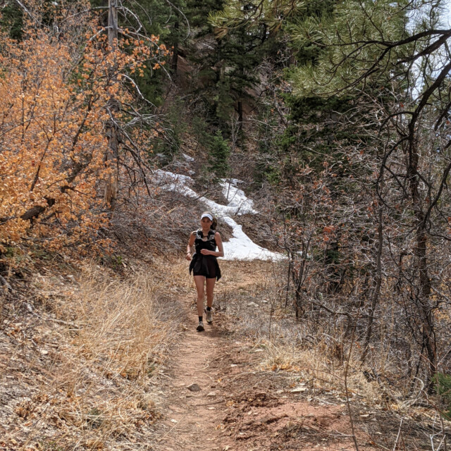 The snow on the slopes made for some muddy sections of trail, but they were mostly easy to avoid. Here's Jayna powering down into the canyon.